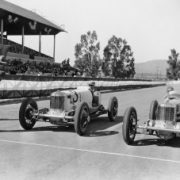Two older cars about to race