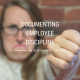 Woman with a frown face with her thumb pointing down - documenting employee discipline HR tip of the week
