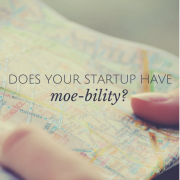 A person looking at a map with title - Does your startup have moe-bility?
